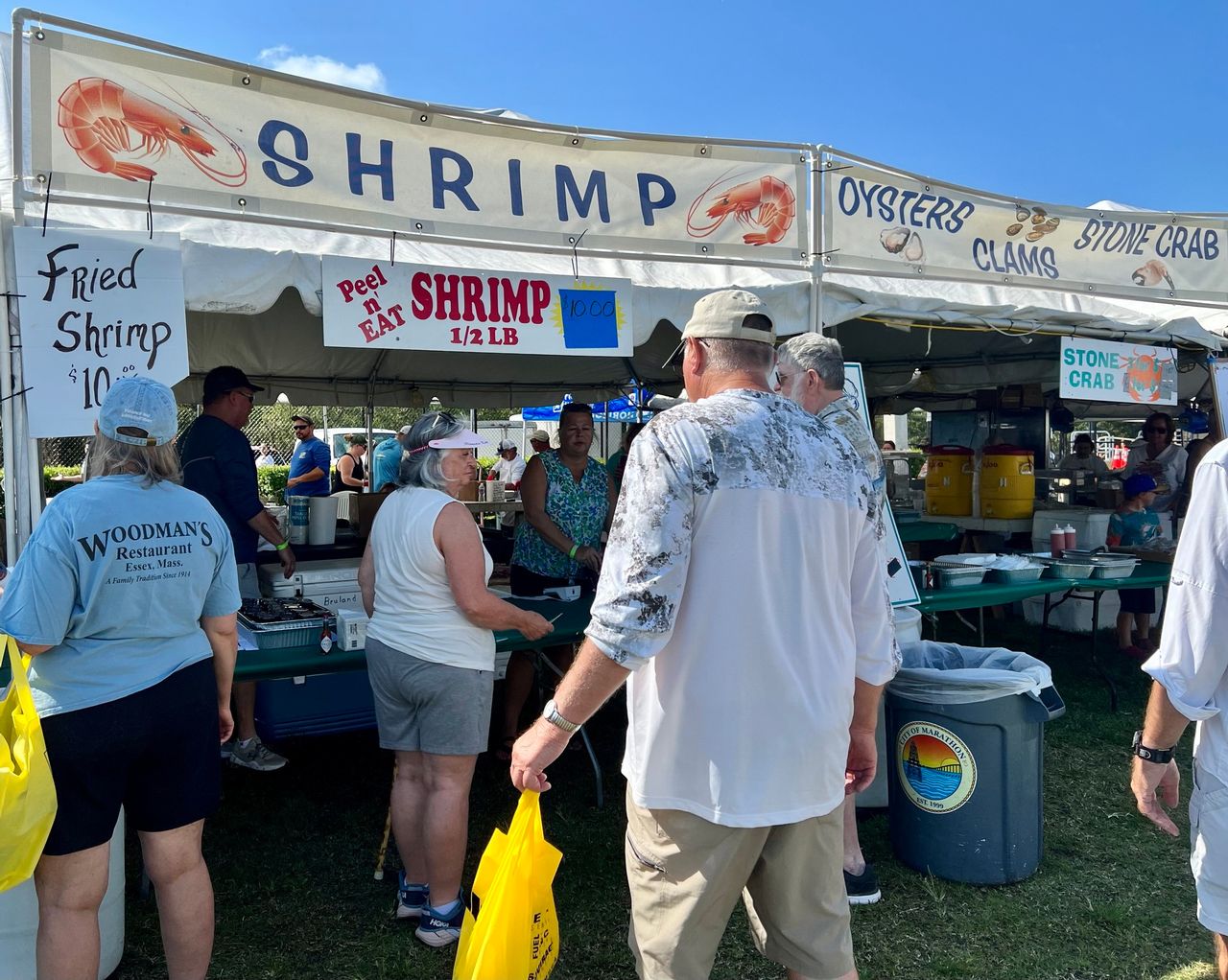 Attendance line up for plates of fresh fishermen-to-fork seafood favorites at the annual Marathon Seafood Festival. Photos by JoNell Modys