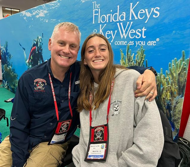 Dawson's youngest daughter, Haylie, worked with him at a recent dive trade show to recruit new divers to experience the underwater world in the Florida Keys. 