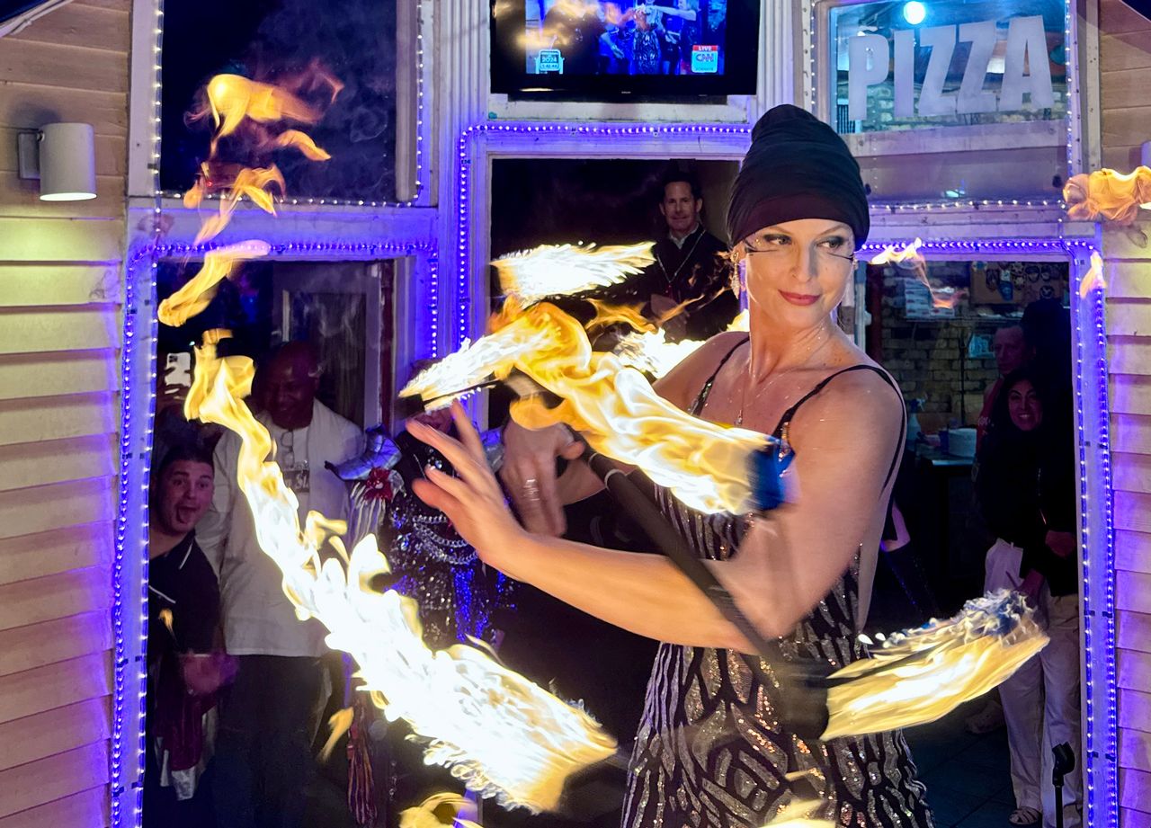Fire dancer Andromeda Fyre performed live on CNN with host Randi Kaye during a live segment from Key West on CNN's New Year's Eve broadcast Dec. 31, 2023. Photo: Andy Newman