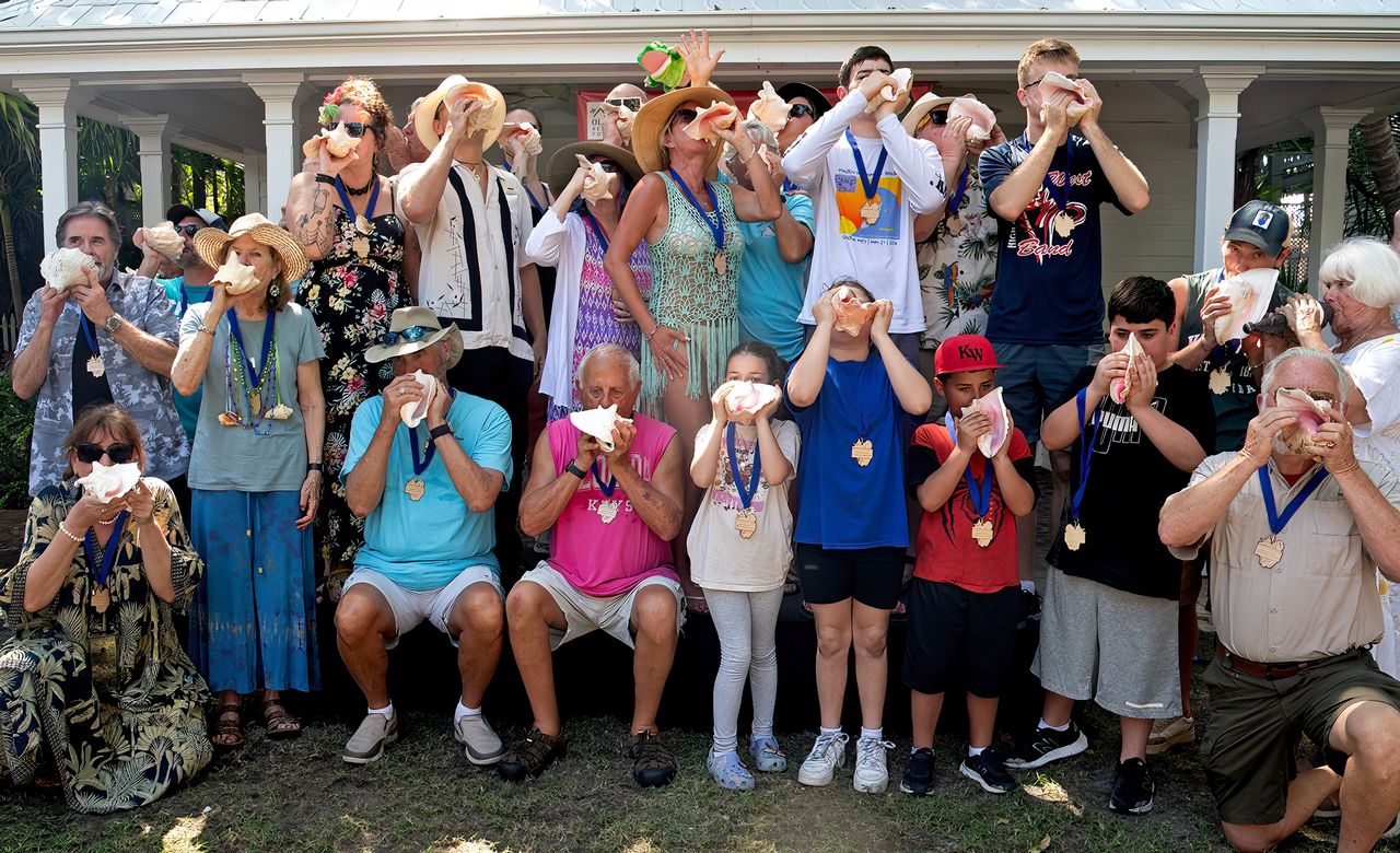 Contestants in the 61st annual Conch Shell Blowing Contest toot their shells in the competition that salutes the Florida Keys' seafaring heritage and use of conch shells for signaling. Photo: Mary Martin