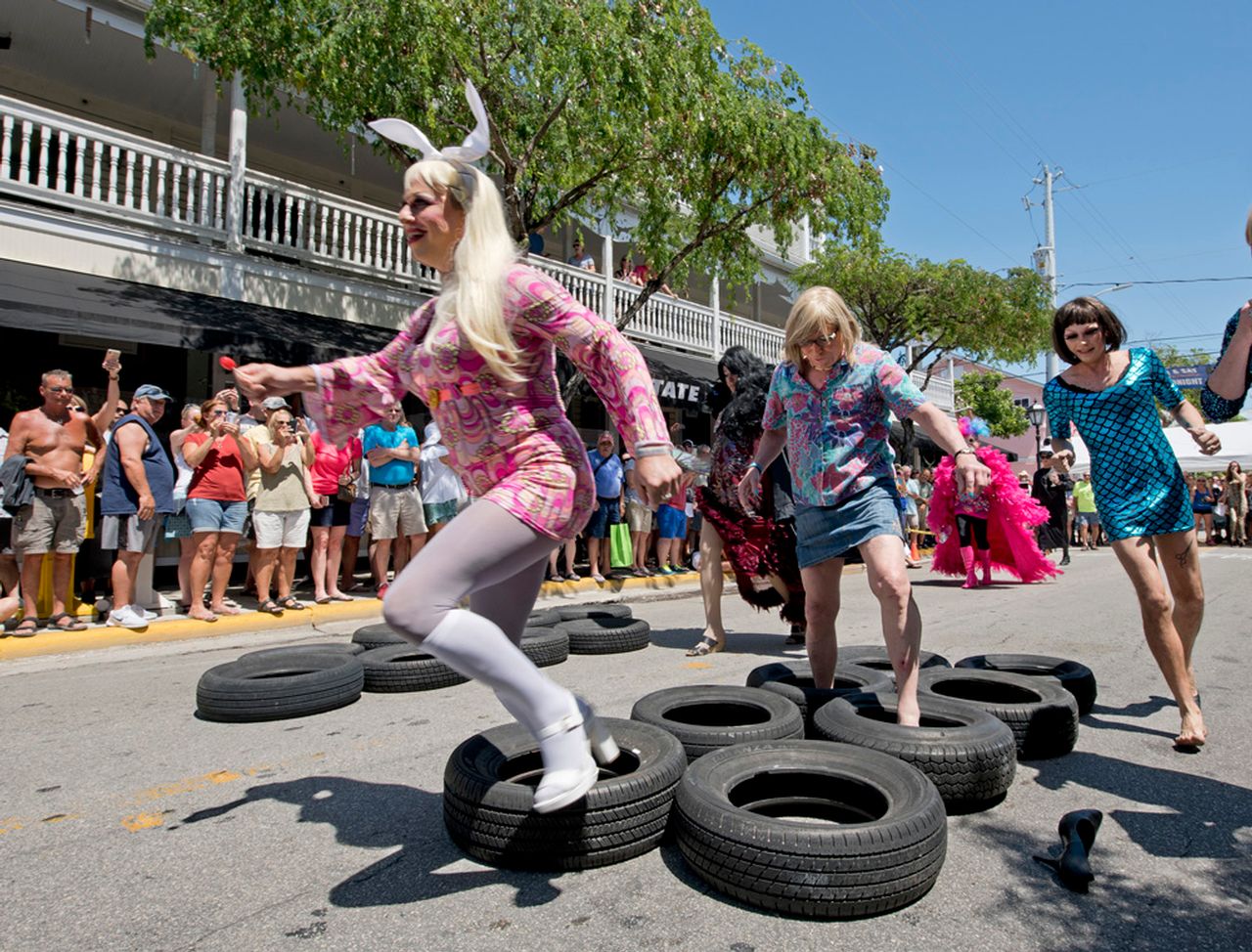 The annual Drag Race is a playful parody of auto racing, with entrants swapping high-speed cars for high-heeled shoes and female drag “ah-tire” while dashing along an improvised  racetrack on Duval Street. 