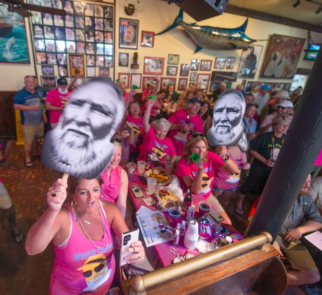 Supporters of Wayne Collins cheer for the entrant during the 2022 Hemingway Look-Alike Contest. 