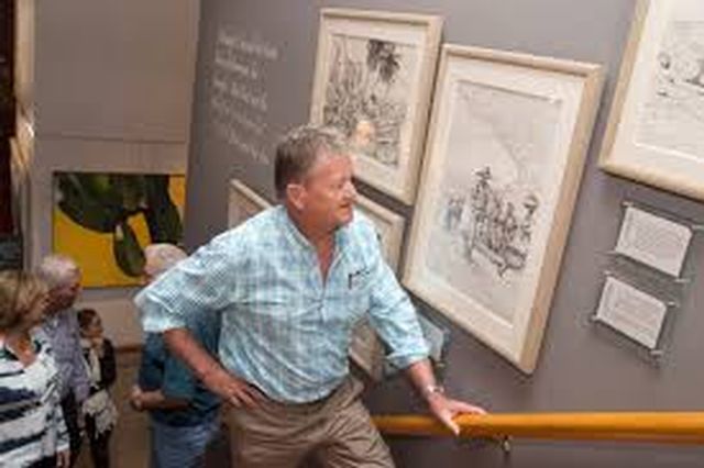 Famed marine wildlife artist Guy Harvey visits his exhibit of 59 original drawings that provide a visual narrative to Hemingway's novel The Old Man and the Sea at the Customs House museum. Photo: Carol Tedesco