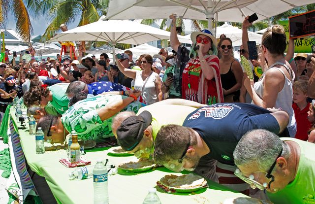 Competitors plunge face-first into creamy Key lime pies during the annual World Famous Key Lime Pie Eating Championship on July 24, 2024. 