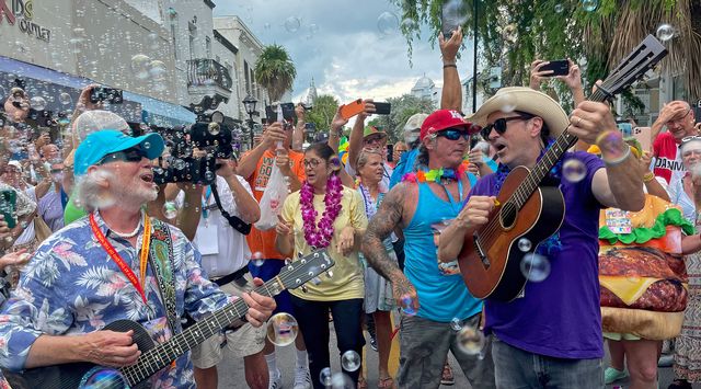 Keys trop rock troubadour Howard Livingston and Buffett songwriting collaborator Will Kimbrough lead the crowd in singing the anthemic Margaritaville. Photo: Carol Shaughnessy