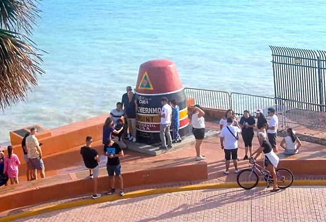 With sunny skies and calm conditions returning just after Milton bypassed the Florida Keys, visitors were back in line for photos of the famed Southernmost Point marker in Key West. Photo: Southernmost Point webcam