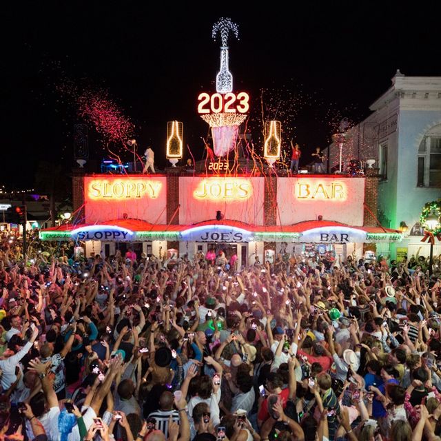 Partiers on Duval Street can watch the annual drop of a gigantic manmade conch shell, the symbol of the Florida Keys, to the flat roof of Sloppy Joe's Bar. Photo: Carol Tedesco