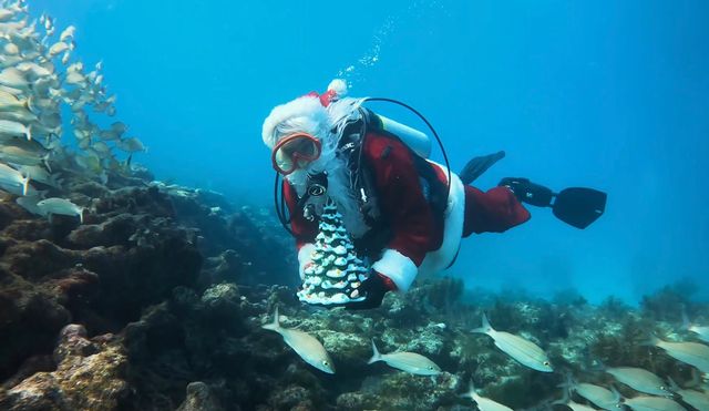 Spencer Slate, owner of Captain Slate's Scuba Adventures, dons his Kris Kringle garb annually.