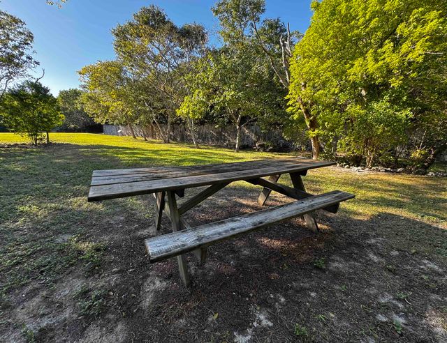 Follow the trails to an old quarry area with an open area and picnic tables. 