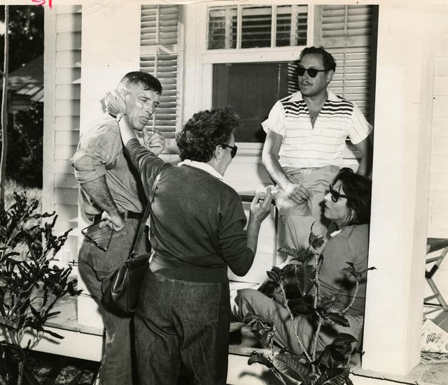 In this photo courtesy of Monroe County Library, Burt Lancaster, Anna Magnani's secretary, Tennessee Williams and Magnani are seen on the porch of the Key West home used in the filming of 'The Rose Tattoo.' 