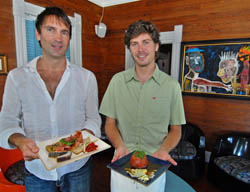 Stuart Kemp, left, owner of nine one five restaurant in Key West, and the restaurant's executive chef, Chris Otten, show two of the eateries' signature dishes including a tapas platter, left, and a tuna dome. Photo by Andy Newman/Florida Keys News Bureau