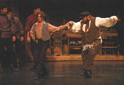 Russian villager (Denis Hyland) teaches Tevye (Dean Walters) traditional dance at wedding feast.