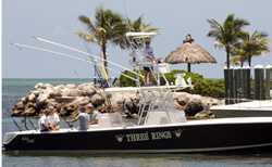 Coach Jimmy Johnson at the wheel of his "Three Rings" center console fishing boat in Islamorada after returning from a day fishing off the Florida Keys.