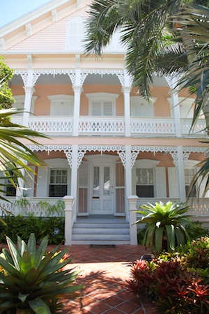 One of the colorfully painted homes in Key West’s historic district, adorned with wooden gingerbread trim.