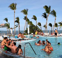 Vacationer enjoy the pool at Holiday Isle Resort in Islamorada Sunday, two days after Hurricane Katrina dumped rain and brisk winds on the Keys. Photo by Bob Care/Florida Keys News Bureau  