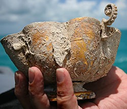 This gold chalice was discovered by Blue Water Ventures diver Michael DeMar, along with other shipwreck salvors. It is believed to come from the 1622 Spanish galleon Santa Margarita. Blue Water is searching for the remains of the Margarita under a joint-venture partnership with Mel Fisher's Treasures. Photo by Gary Randolph/Mel Fisher's Treasures 

