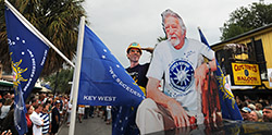 Mike Mongo salutes a life-size photo of Anthony "Tony" Tarracino Saturday in front of Captain Tony's Saloon. Photos by Andy Newman/Florida Keys News Bureau.