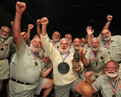 Tom Grizzard, middle, celebrates with other previous winners after winning Sloppy Joe's 2008 "Papa" Hemingway Look-Alike Contest.