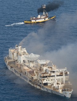 The former U.S. Air Force missile-tracking ship Gen. Hoyt S. Vandenberg begins to sink after cutting charges were detonated Wednesday, May 27, 2009