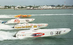 Super Cat class offshore racing powerboats cross the start line in Key West Harbor during first of two races that comprise Key West Offshore Worlds powerboat racing championship. .